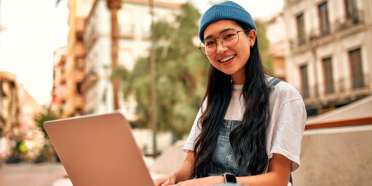 Asian female tourist student on city streets